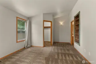 Spacious primary suite with vaulted ceiling, walk-in closet and 3/4 bath.