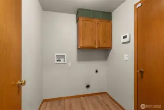 Utility room conveniently located off the garage.