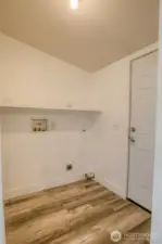 Laundry room with door to back deck