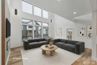 This great room has high ceilings and huge windows to let in a lot of light!