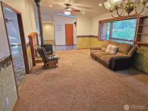 Large picture windows view out to the lush landscaping features