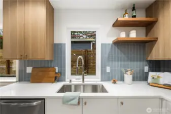 Extra deep single stainless undermount sink and re-claimed wood shelving