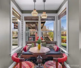 Breakfast nook overlooking the beautiful backyard and outdoor living