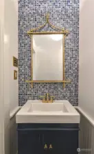 Elegantly stylized bathroom, with tile backsplash