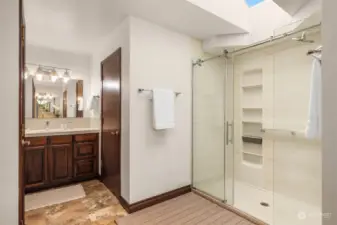 The primary bath has two walk in closets, two vanities and a walk in shower.