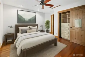 The 2nd upstairs bedroom features custom built-in closets, offering both functionality and style. Along with your own private deck to enjoy your morning coffee in the fresh mountain air.