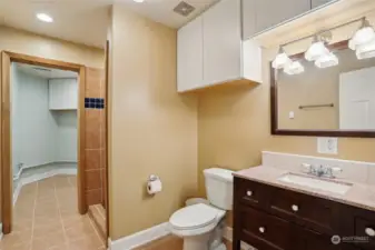 Bathroom downstairs with full laundry room