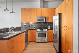 Treat the cook to granite surfaces & built-in stainless appliances.