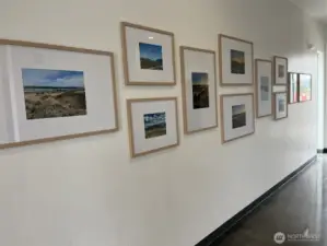 Halway leading to the office and meeting room. Inside bathrooms to the right