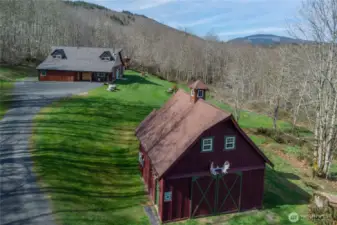 Stunning custom built home and shop on 20 private acres, with an artesian well, generator, mt views + more.