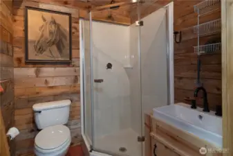 The shop/garage has a 3/4 bath plus a washing machine and dryer, and of course, a hot water tank.