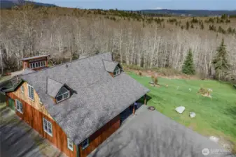 Stunningly beautiful setting with a quality, custom built home and shop.  And look at Mt. Baker in the background!