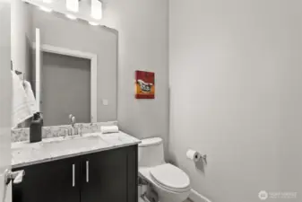 Half bath, featuring modern fixtures and a clean design to ensure comfort for your guests.