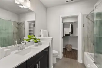 En-suite featuring spa-inspired finishes and spacious walk-in closet for ultimate comfort and convenience.