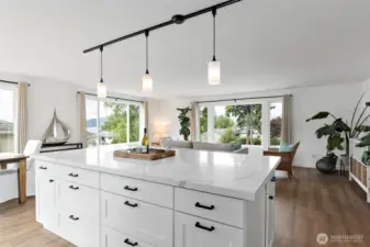 Enjoy a brand-new, oversized island with ample seating—perfect for gathering and entertaining. Featuring stunning quartz countertops and an abundance of storage, this kitchen combines style, function, and convenience.