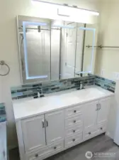 DOUBLE SINK W/ NICE ADDED FEATURES TO PAMPER YOU WITH.
