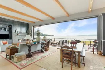 Great Room room with 12' beamed ceilings and wall of disappearing glass.