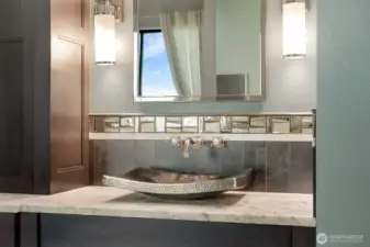 Gorgeous primary bath w/Carrera marble and heated floors. Large walk in shower, hammered Nickel sinks and Victoria & Albert Limestone freestanding tub