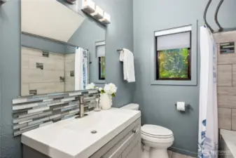 An updated full bathroom complements the secondary bedroom wing