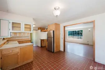views of kitchen, living room and dining area. Nice large cased opening.