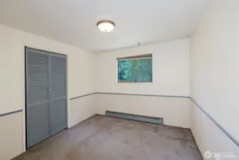 3rd bedroom, closet. This window also looks over the deck and stream.