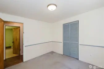 Another shot of 3rd bedroom looking into hallway and primary bedroom accross the hall.