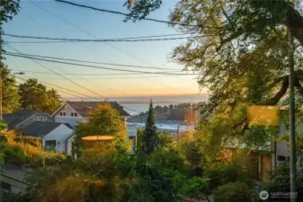 Ever-changing skies over Puget Sound set a tranquil backdrop, where shifting light and water create a daily rhythm of calm.”