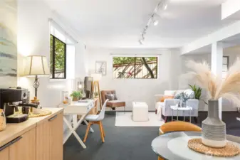 Garden-level living and dining area (12’-6” x 27’-0”), a flexible zone for media, office, or potential ADU layout.