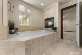 Beautiful jetted tub with cozy fireplace