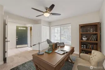 Versatile front bedroom filled with natural light, perfect as a quiet home office or cozy reading space. Fresh paint, new carpet, and modern finishes create an inviting first impression.