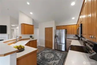 Spacious kitchen with abundant cabinetry, stainless steel appliances, and generous counter space—ideal for cooking, entertaining, and everyday convenience.