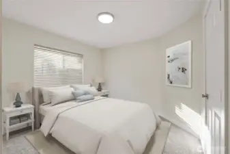 Comfortable and inviting guest bedroom with soft natural light, new carpet, and a neutral color palette ready to fit any style.