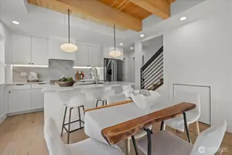 Dedicated dining area with 4th bonus room downstairs usable as office, flex space, or alternative dining space.