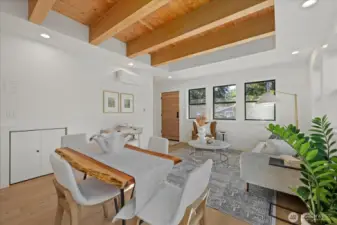 Living room.  Powder room under the stairs.  Garage door on the right hand side.