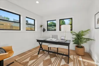 Main-floor office, flex room, dedicated dining room, or 4th bedroom.  Plenty of space for a large table or queen bed.