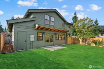 Private, 2694sqft yard with large grassy area for relaxing and entertaining.  Get the best of both worlds - a new construction home that actually comes with a yard!  Utility room with additional storage through the left-side door.