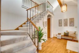 Upstairs features a gorgeous display of windows and stylish catwalk from the primary suite to the separate bedrooms and bath.