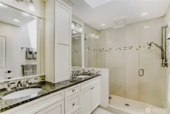 Luxurious primary bath with a dual sink vanity and a large step in shower.