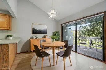 The furnishings in this photo are AI, but the fabulous chandelier and views are very real! Love the vaulted ceilings and great deck space, too.