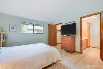 Another angle in the primary bedroom, with a 3/4 bath with new shower, and a walk in closet on the left.