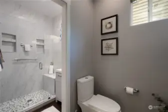 first floor bathroom off bedroom and kitchen offers style and convenience.