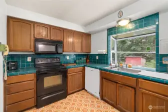 another angle of Kitchen from Dining w/Garden Window overlooking the Garden Spaces !