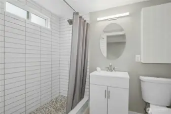 Updated lower level bathroom attached to primary suite.