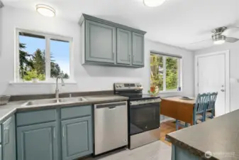 Kitchen and dining room overlook backyard