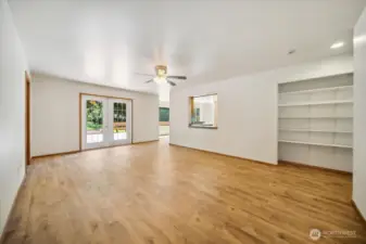 Family room with built-ins and french doors to deck