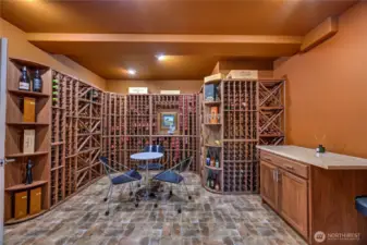 The walk-in wine cellar naturally stays around 63 degrees and offers storage for hundreds of bottles. There is room to sip and relax, with a mini-fridge and counter area for preserving and tasting your collection.