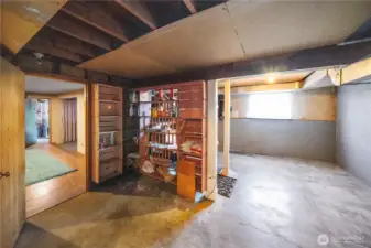 tear wall down and relocate stairs like other renovations. Add slider out to backyard of window