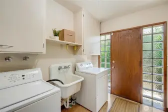 Laundry room behind kitchen.