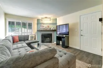 Spacious living room with slider to the amazing oversized patio! Extra touch plantation shutters on the slider.