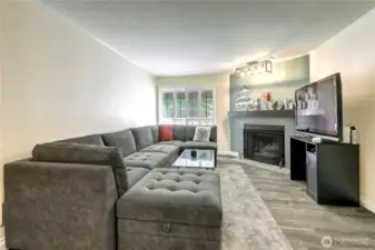 Wood burning fireplace and over mantle display lighting.